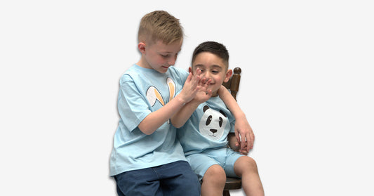 Naughty-adorable-boys-in-cool-blue-graphic-t-shirts-with-shorts-from-Krazebear