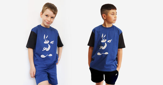 "Boys wearing blue and black Krazebear t-shirt with abstract bunny graphic – casual and durable clothing for energetic kids."